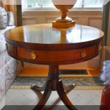 F26. Round inlayed drum table with drawers. 25”h x 28”w 
